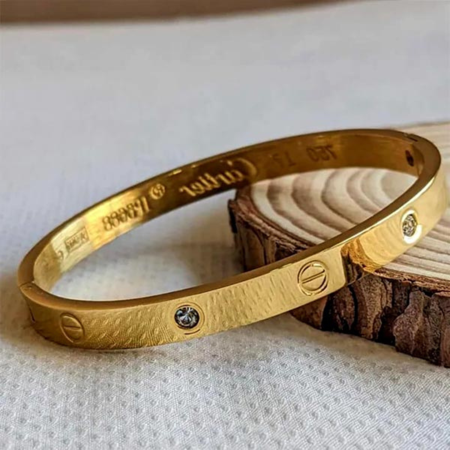 Gold Tone Screw Motif Cuff Bracelet with CZ Stones