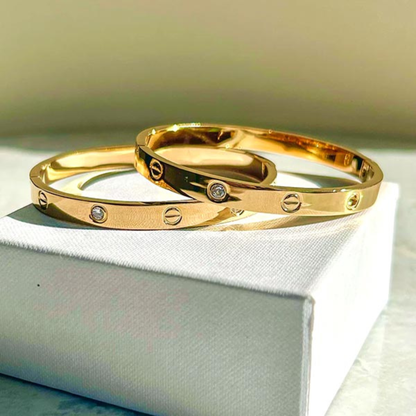 Gold Tone Screw Motif Cuff Bracelet with CZ Stones